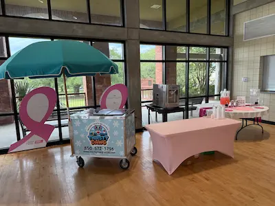 Frozen treat cart and soft serve at community event.